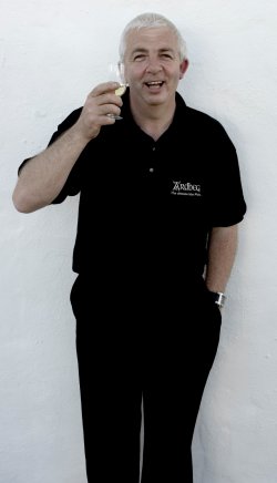 Mickey Heads celebrates 10 years asw the Ardbeg distillery manager.