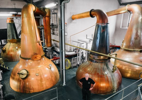 Spirit stills, 1st left and 3rd from left with copper purifying cooling rings on the neck of the stills.