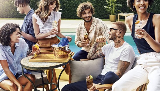 David Beckham with Haig Club Clubman and cola cocktails by a poolside. David Beckham with Haig Club Clubman and cola cocktails by a poolside.